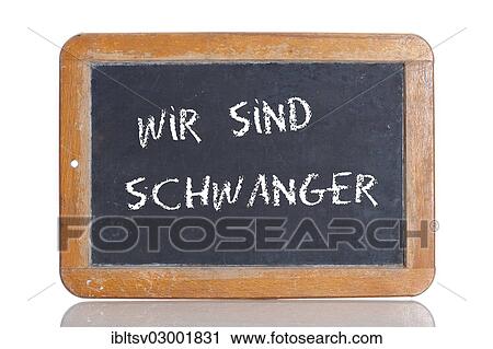 Stock Image - "Old school blackboard with the words WIR SIND SCHWANGER, German for We are pregnant". Fotosearch