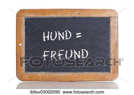 Stock Image - "Old school blackboard with the words HUND = FREUND, German for Dog = Friend". Fotosearch