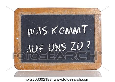 Stock Photo - "Old school blackboard with the words WAS KOMMT AUF UNS ZU?, German for What's in store for us? ". Fotosearch
