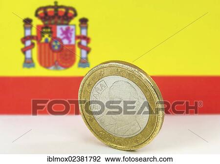 Stock Image - Old Spanish one euro coin in front of the Spanish flag. Fotosearch