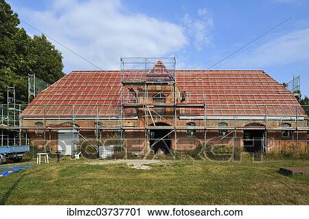 "Old stables, 1921, with scaffolding for renovation, Othenstorf, Mecklenburg-Western Pomerania, Germany, Europe" View Large Photo Image Stock Image - "Old stables, 1921, with scaffolding for renovation, Othenstorf, Mecklenburg-Western Pomerania, Germany, Europe". Fotosearch