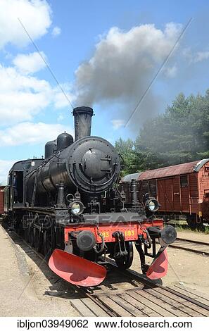 Stock Image - "Old steam locomotive at a railway station, Brosarp, Skane, Sweden, Europe". Fotosearch