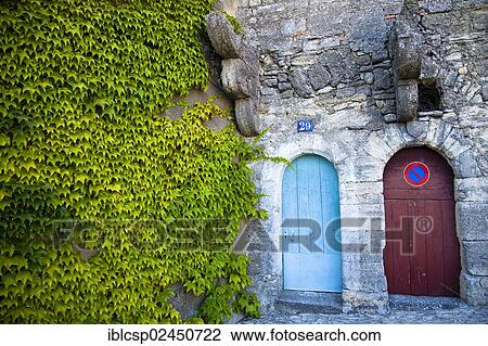 "Old stone building with two doors, overgrown facade, Bonnieux, Vaucluse, Provence, France, Europe" View Large Photo Image Stock Image - "Old stone building with two doors, overgrown facade, Bonnieux, Vaucluse, Provence, France, Europe". Fotosearch