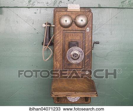Stock Image - "Old telephone with crank in the Museum City, South Pass City, Wyoming, United States, North America". Fotosearch