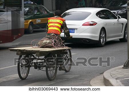 "Old transport bicycle in front of a Porsche, Beijing, China, People's Republic of China, Asia" View Large Photo Image Stock Image - "Old transport bicycle in front of a Porsche, Beijing, China, People's Republic of China, Asia". Fotosearch