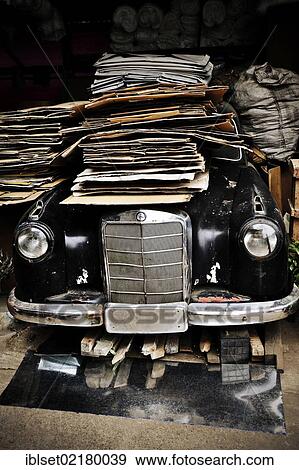 Stock Photo - "Old vintage Mercedes covered with cardboard in Yangon, Myanmar, Burma, Southeast Asia, Asia". Fotosearch