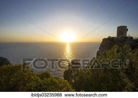 "Old watchtower on the coast at sunset, Torre Talaia de Ses Animes, Banyalbufar, Majorca, Balearic Islands, Spain, Europe" View Large Photo Image Stock Photo - "Old watchtower on the coast at sunset, Torre Talaia de Ses Animes, Banyalbufar, Majorca, Balearic Islands, Spain, Europe". Fotosearch
