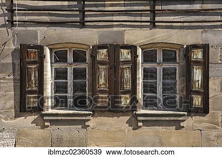"Old windows with shutters, detailed view of a sandstone house dating from the 18th century, Bayreuther Strasse strasse 9, Schnaittach, Middle Franconia, Bavaria, Germany, Europe" View Large Photo Image Stock Photo - "Old windows with shutters, detailed view of a sandstone house dating from the 18th century, Bayreuther Strasse strasse 9, Schnaittach, Middle Franconia, Bavaria, Germany, Europe". Fotosearch