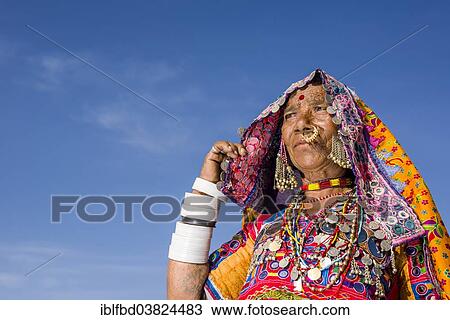 "Old woman belonging to the local tribe of Lambani wearing the traditional colorful dress, Bijapur, Karnataka, India, Asia" View Large Photo Image Stock Image - "Old woman belonging to the local tribe of Lambani wearing the traditional colorful dress, Bijapur, Karnataka, India, Asia". Fotosearch