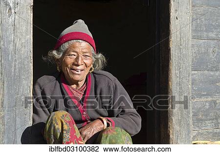 "Old woman sitting in the doorway of a farmers house, Shivalaya, Solukhumbu District, Sagarmatha Zone, Nepal, Asia" View Large Photo Image Stock Image - "Old woman sitting in the doorway of a farmers house, Shivalaya, Solukhumbu District, Sagarmatha Zone, Nepal, Asia". Fotosearch