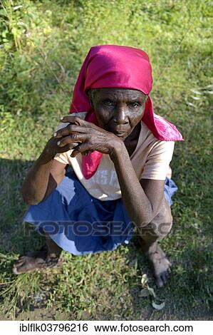 "Old woman sitting in the grass, Tchawa, Leogane, Haiti, North America" View Large Photo Image Stock Photograph - "Old woman sitting in the grass, Tchawa, Leogane, Haiti, North America". Fotosearch