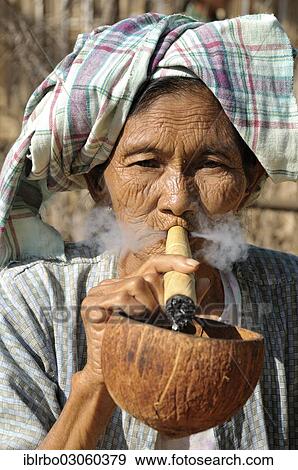 "Old woman smoking a cheroot cigar, Bagan, Myanmar, Burma, Asia" View Large Photo Image Stock Photo - "Old woman smoking a cheroot cigar, Bagan, Myanmar, Burma, Asia". Fotosearch