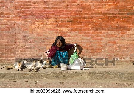 "Old woman spinning thread on Durbar Square, Kathmandu Valley, Kathmandu, Kathmandu District, Bagmati Zone, Nepal, Asia" View Large Photo Image Stock Photograph - "Old woman spinning thread on Durbar Square, Kathmandu Valley, Kathmandu, Kathmandu District, Bagmati Zone, Nepal, Asia". Fotosearch