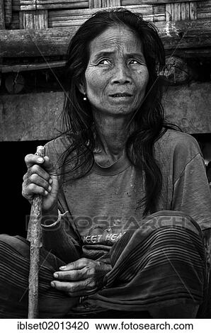 "Old woman with a cane in a village on the Mekong River, Laos, Southeast Asia, Asia" View Large Photo Image Stock Image - "Old woman with a cane in a village on the Mekong River, Laos, Southeast Asia, Asia". Fotosearch