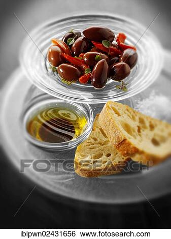 Stock Photograph - "Olives, bread and oil for dipping". Fotosearch