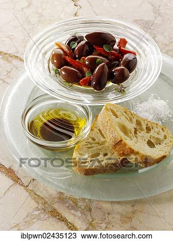 "Olives, dipping oil and ciabatta snack" View Large Photo Image Stock Image - "Olives, dipping oil and ciabatta snack". Fotosearch