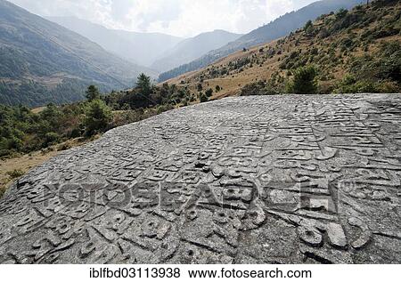 "Om mani padme hum"""" mantra carved in a big rock, mountains in the background, Junbesi, Solukhumbu District, Sagarmatha Zone, Nepal, Asia" View Large Photo Image Stock Photo - "Om mani padme hum"""" mantra carved in a big rock, mountains in the background, Junbesi, Solukhumbu District, Sagarmatha Zone, Nepal, Asia". Fotosearch
