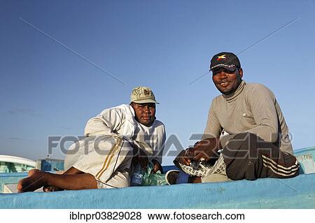 "Omani fishermen on a fishing boat, Mirbat, Dhofar region, Sultanate of Oman, Arabian Peninsula" View Large Photo Image Stock Photo - "Omani fishermen on a fishing boat, Mirbat, Dhofar region, Sultanate of Oman, Arabian Peninsula". Fotosearch