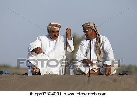 "Omanis talking while sitting in traditional clothing, Barka, Al-Batinah province, Oman, Arabian Peninsula, Asia" View Large Photo Image Stock Image - "Omanis talking while sitting in traditional clothing, Barka, Al-Batinah province, Oman, Arabian Peninsula, Asia". Fotosearch