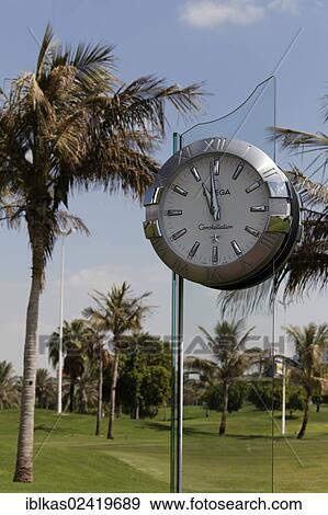 Omega Constellation oversized clock, Dubai Creek Golf Club, Dubai, United Arab Emirates, Middle East, Asia View Large Photo Image Stock Photo - Omega Constellation oversized clock, Dubai Creek Golf Club, Dubai, United Arab Emirates, Middle East, Asia. Fotosearch