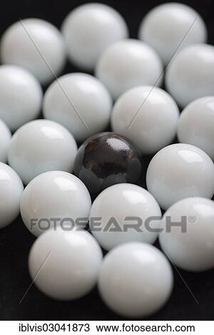One black marble among many white marbles View Large Photo Image Stock Image - One black marble among many white marbles. Fotosearch