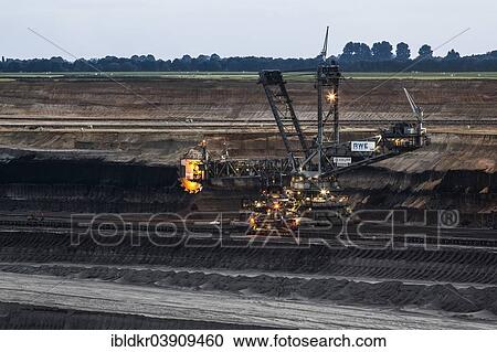 Stock Image - "Open-cast lignite mining, spreader, Juchen lookout point, Garzweiler open-cast mine, Juchen, North Rhine-Westphalia, Germany, Europe". Fotosearch