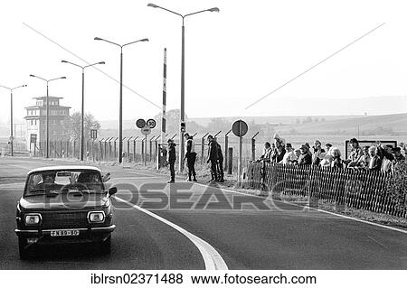 Stock Photo - "Open inner-German border between Lower Saxony and the district of Erfurt, Thuringia, in the morning after the opening of the border was announced, GDR citizens leaving on the road from Worbis to Duderstadt, Duderstadt, Lower Saxony, Germany, Europe". Fotosearch