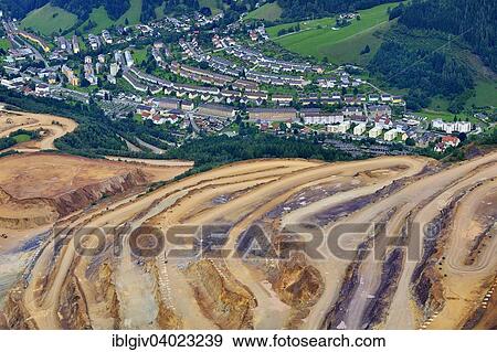 Stock Photo - "Open pit ore mining and workers' settlements, Erzberg mountain at Eisenerz, Styria, Austria, Europe". Fotosearch