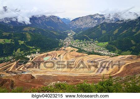 "Open pit ore mining, Eisenerz village and Erzbachtal valley, Erzberg mountain at Eisenerz, Styria, Austria, Europe" View Large Photo Image Stock Photography - "Open pit ore mining, Eisenerz village and Erzbachtal valley, Erzberg mountain at Eisenerz, Styria, Austria, Europe". Fotosearch