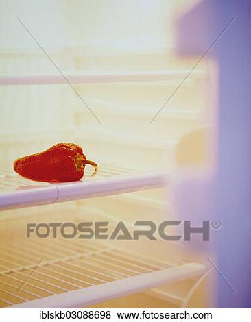 Stock Photo - Open refrigerator filled with a red pepper. Fotosearch