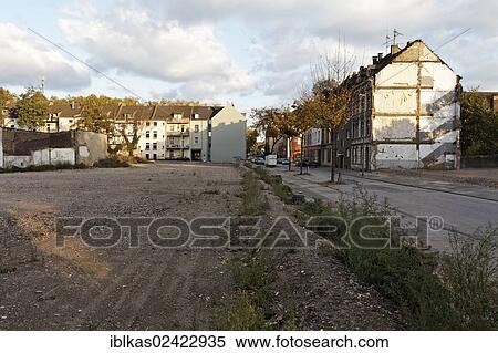 Open space following the demolition of houses, neighborhood redevelopment, green belt project, Duisburg-Bruckhausen, Ruhr area, North Rhine-Westphalia, Germany, Europe View Large Photo Image Stock Photography - Open space following the demolition of houses, neighborhood redevelopment, green belt project, Duisburg-Bruckhausen, Ruhr area, North Rhine-Westphalia, Germany, Europe. Fotosearch