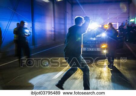 Stock Photo - "Operational tactics training for the police, handling of violent combat situations, firearms training, defence, arrest of a man with a gun, Regional Police Training Centre for Eastern Westphalia". Fotosearch