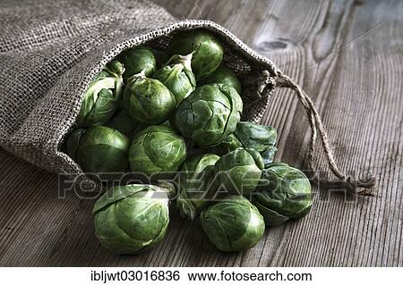 Organic Brussels sprouts in a jute sack on a wooden surface View Large Photo Image Stock Photograph - Organic Brussels sprouts in a jute sack on a wooden surface. Fotosearch