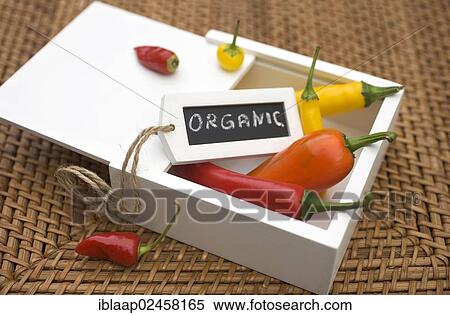 "Organic peppers in a wooden box with a chalk sign """"organic""""" View Large Photo Image Stock Photography - "Organic peppers in a wooden box with a chalk sign """"organic""""". Fotosearch