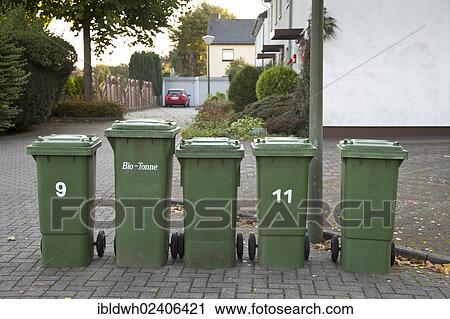 Stock Image - "Organic waste collection bins standing on the side of the road, Kamen, Ruhr area, North Rhine-Westphalia, Germany, Europe, PublicGround, Europe". Fotosearch