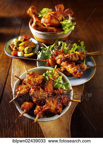 Oriental party buffet food with chicken satay View Large Photo Image Stock Image - Oriental party buffet food with chicken satay. Fotosearch