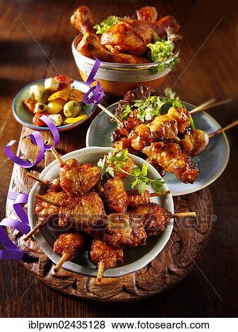 Oriental party buffet food with chicken satay View Large Photo Image Stock Photo - Oriental party buffet food with chicken satay. Fotosearch
