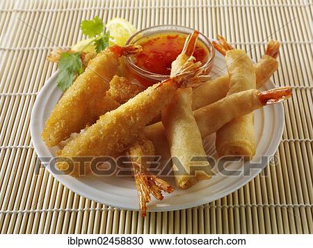Oriental selection with bread coated and battered prawns with a chilli dipping sauce View Large Photo Image Stock Image - Oriental selection with bread coated and battered prawns with a chilli dipping sauce. Fotosearch