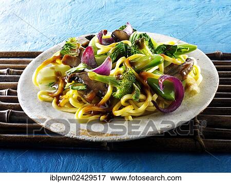 Stock Photo - "Oriental vegetarian stir fry of vegetables, noodles and mushrooms". Fotosearch