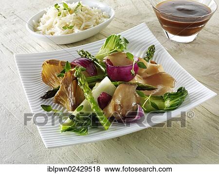 Stock Photo - "Oriental vegetarian stir fry of vegetables, noodles and mushrooms". Fotosearch