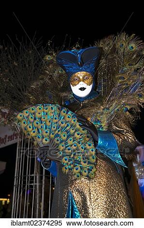 "Ornate costume with peacock feathers and a golden mask, Venetian Fair, Ludwigsburg, Baden-Wuerttemberg, Germany, Europe" View Large Photo Image Stock Photography - "Ornate costume with peacock feathers and a golden mask, Venetian Fair, Ludwigsburg, Baden-Wuerttemberg, Germany, Europe". Fotosearch