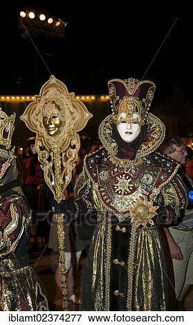 "Ornate masks and gold-embroidered costumes at the Venetian Fair, Ludwigsburg, Baden-Wuerttemberg, Germany, Europe" View Large Photo Image Stock Photo - "Ornate masks and gold-embroidered costumes at the Venetian Fair, Ludwigsburg, Baden-Wuerttemberg, Germany, Europe". Fotosearch