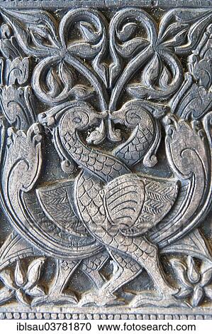 Stock Image - "Ornate wood carving, two peacocks, Embekke Devale Temple, near Kandy, Central Province, Sri Lanka, Asia". Fotosearch