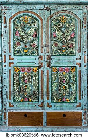 "Ornately carved flowers in a turquoise cabinet door, Kochi, Kerala, India, Asia" View Large Photo Image Stock Photograph - "Ornately carved flowers in a turquoise cabinet door, Kochi, Kerala, India, Asia". Fotosearch