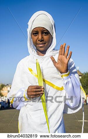 "Orthodox girl praying at the Easter ceremony, Asmara, Eritrea, Africa" View Large Photo Image Stock Photo - "Orthodox girl praying at the Easter ceremony, Asmara, Eritrea, Africa". Fotosearch