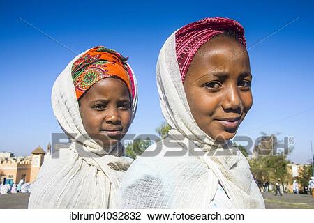 Stock Image - "Orthodox girls dressed for the Easter ceremony, Asmara, Eritrea, Africa". Fotosearch
