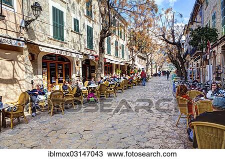 "Outdoor cafes in a street, historic center, Valldemossa, Majorca, Balearic Islands, Spain, Europe" View Large Photo Image Stock Image - "Outdoor cafes in a street, historic center, Valldemossa, Majorca, Balearic Islands, Spain, Europe". Fotosearch