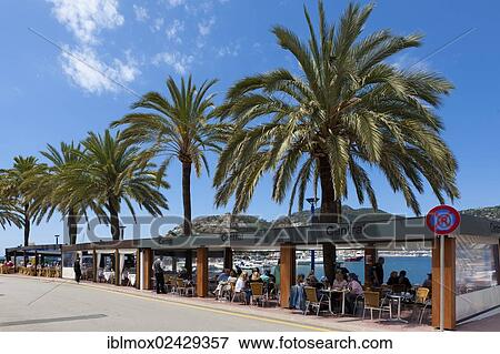 "Outdoor restaurants with tourists at the bay of Puerto Andratx, Port d'Andratx, Mallorca, Balearic Islands, Spain, Europe" View Large Photo Image Stock Photo - "Outdoor restaurants with tourists at the bay of Puerto Andratx, Port d'Andratx, Mallorca, Balearic Islands, Spain, Europe". Fotosearch