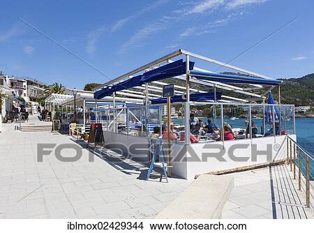 "Outdoor restaurants with tourists in Sant Elm, municipality of Andratx, Sant Elm, Mallorca, Balearic Islands, Spain, Europe" View Large Photo Image Picture - "Outdoor restaurants with tourists in Sant Elm, municipality of Andratx, Sant Elm, Mallorca, Balearic Islands, Spain, Europe". Fotosearch