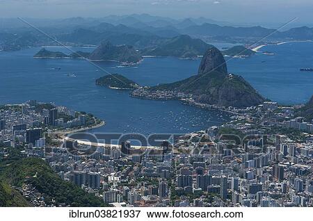 "Outlook from the Christ the Redeemer statue over Rio de Janeiro and the Sugar Loaf, Brazil, South America" View Large Photo Image Stock Photo - "Outlook from the Christ the Redeemer statue over Rio de Janeiro and the Sugar Loaf, Brazil, South America". Fotosearch